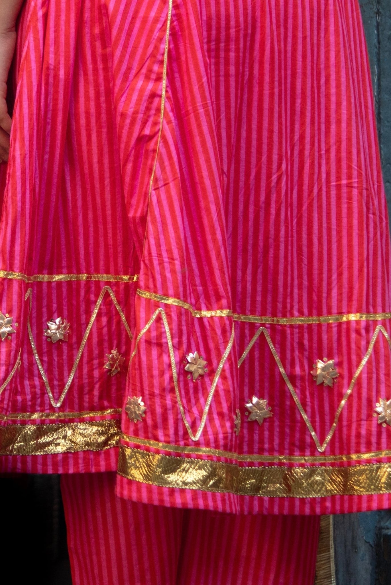 Anaaro - fuschia pink Bagdi dress in 100% striped cotton with hand embroidered gota flowers and sequins. - CiceroniDressAnaaro