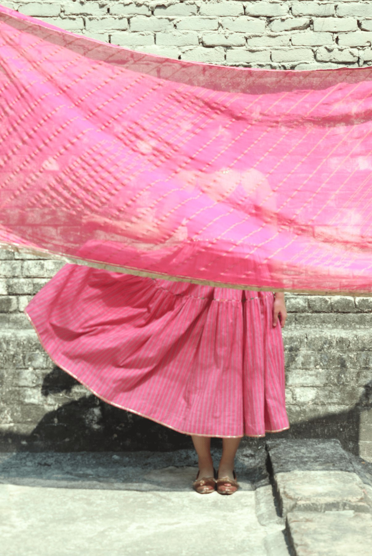Anaaro - pink kanchli strappy dress in hand block print stripes with multicoloured piping detail - CiceroniDressAnaaro