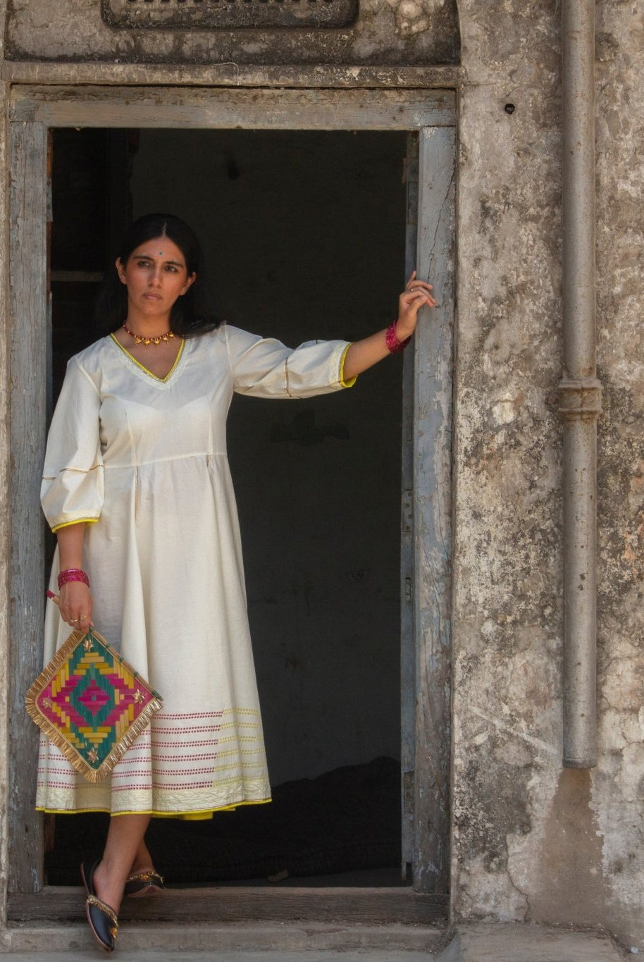 Anaaro - white Bagdi dress in 100% cotton with neon hand block print border and contrasting piping - CiceroniDressAnaaro