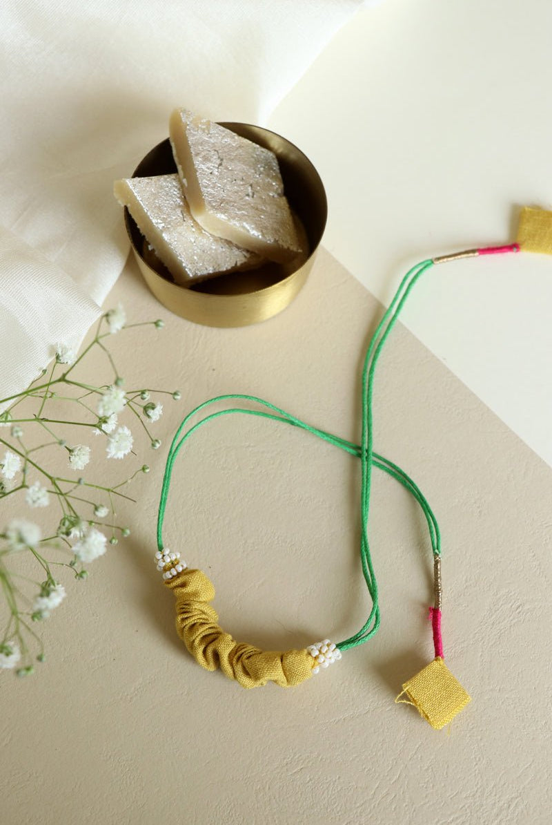 Upcycled Artisanal Rakhi - Yellow - CiceroniRakhiLukka Chuppi