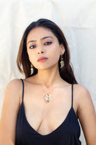 AVANI Gold Faux Tiger Claw Red Lens Pendant - CiceroniBaka