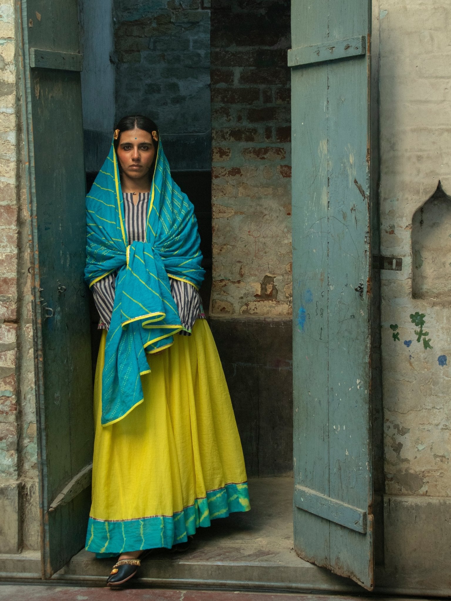 Anaaro - lime yellow Khara panelled skirt in solid cotton kota doria with tie and dye leheriya border - CiceroniSkirtAnaaro