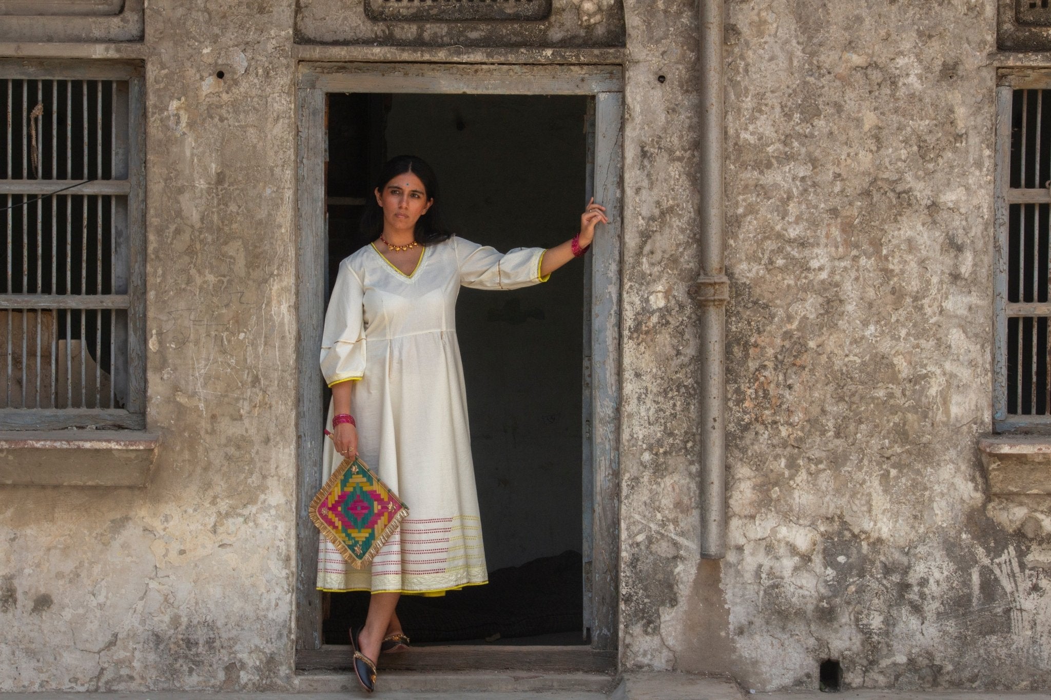 Anaaro - white Bagdi dress in 100% cotton with neon hand block print border and contrasting piping - CiceroniDressAnaaro