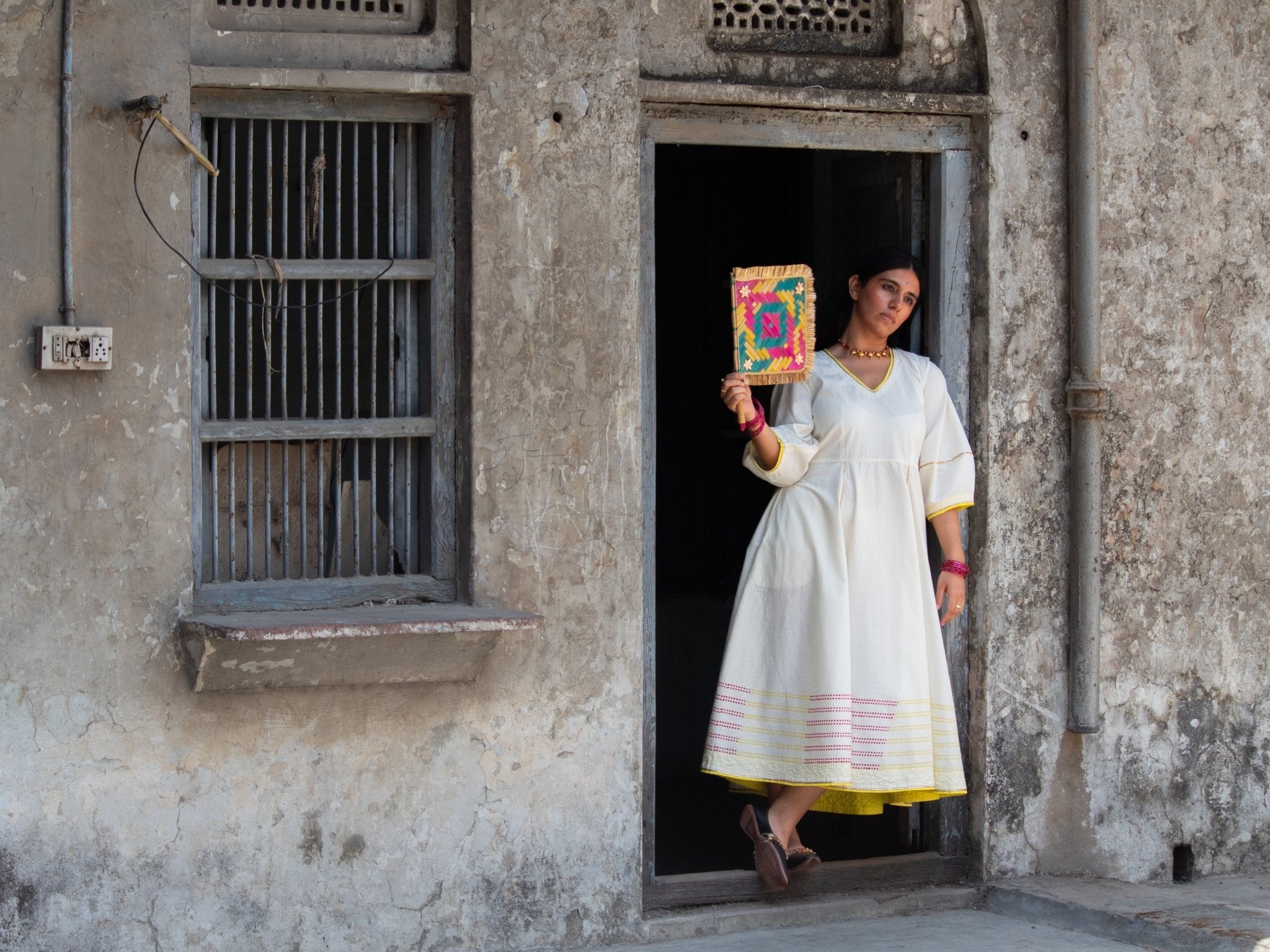 Anaaro - white Bagdi dress in 100% cotton with neon hand block print border and contrasting piping - CiceroniDressAnaaro